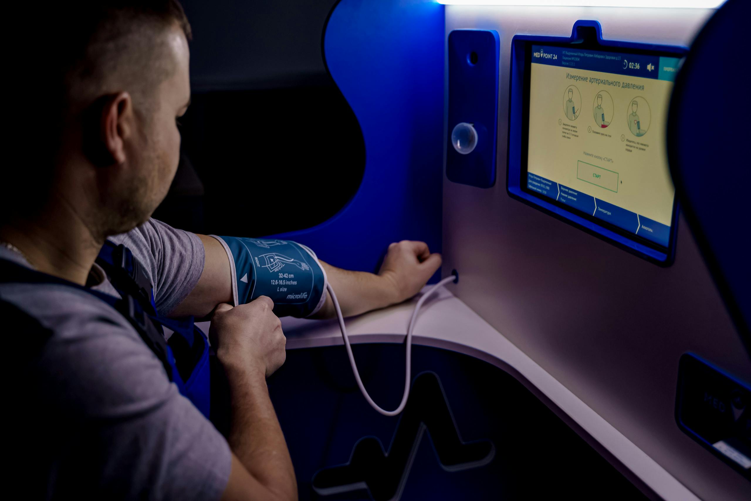 A Man Measuring His Blood Pressure Digitally